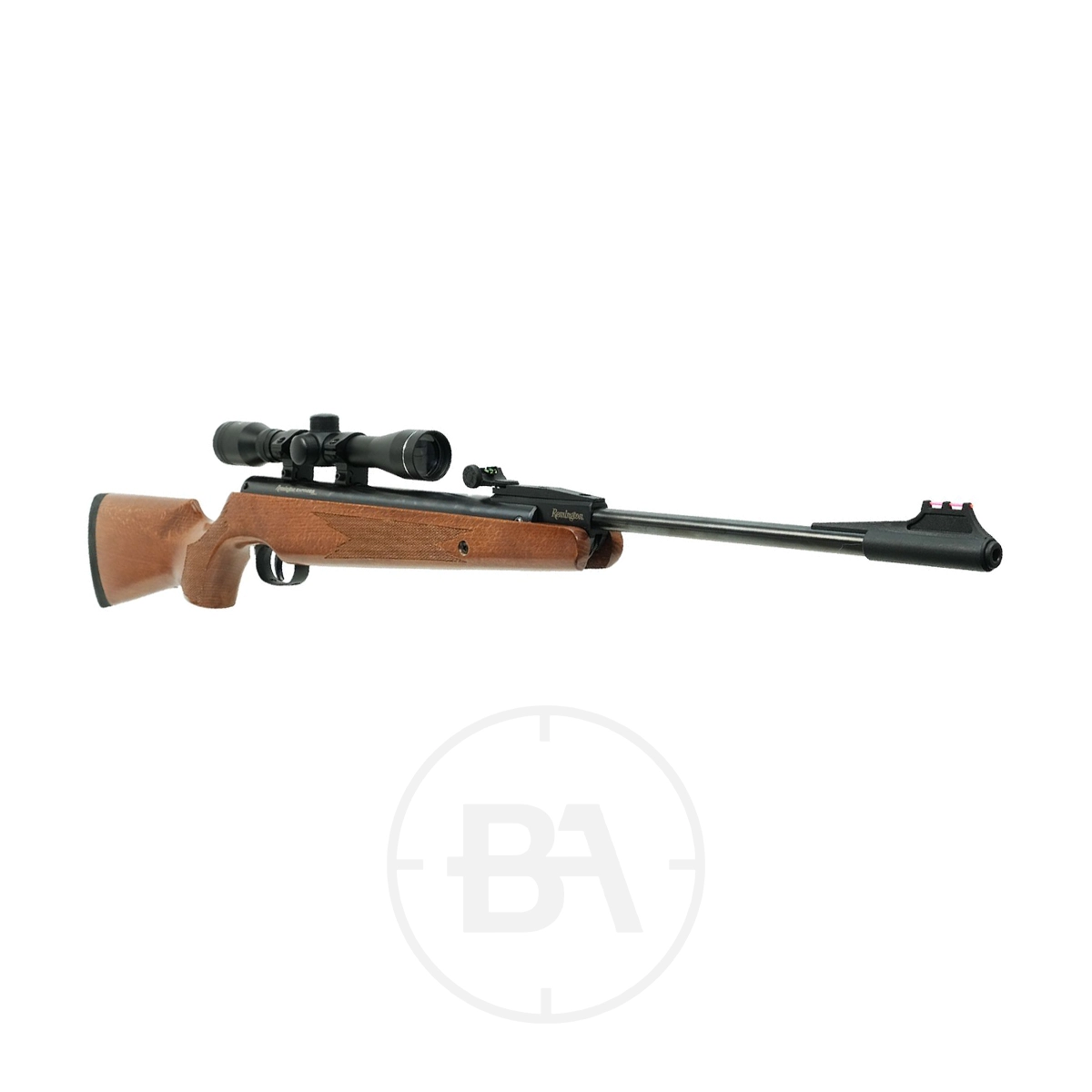 Remington Express Compact Spring Air Rifle With Scope 7 The Remington Express Compact Spring Air Rifle With Scope, featuring a wooden stock and black barrel, is shown in side view on a white background with its mounted scope for precision shooting.