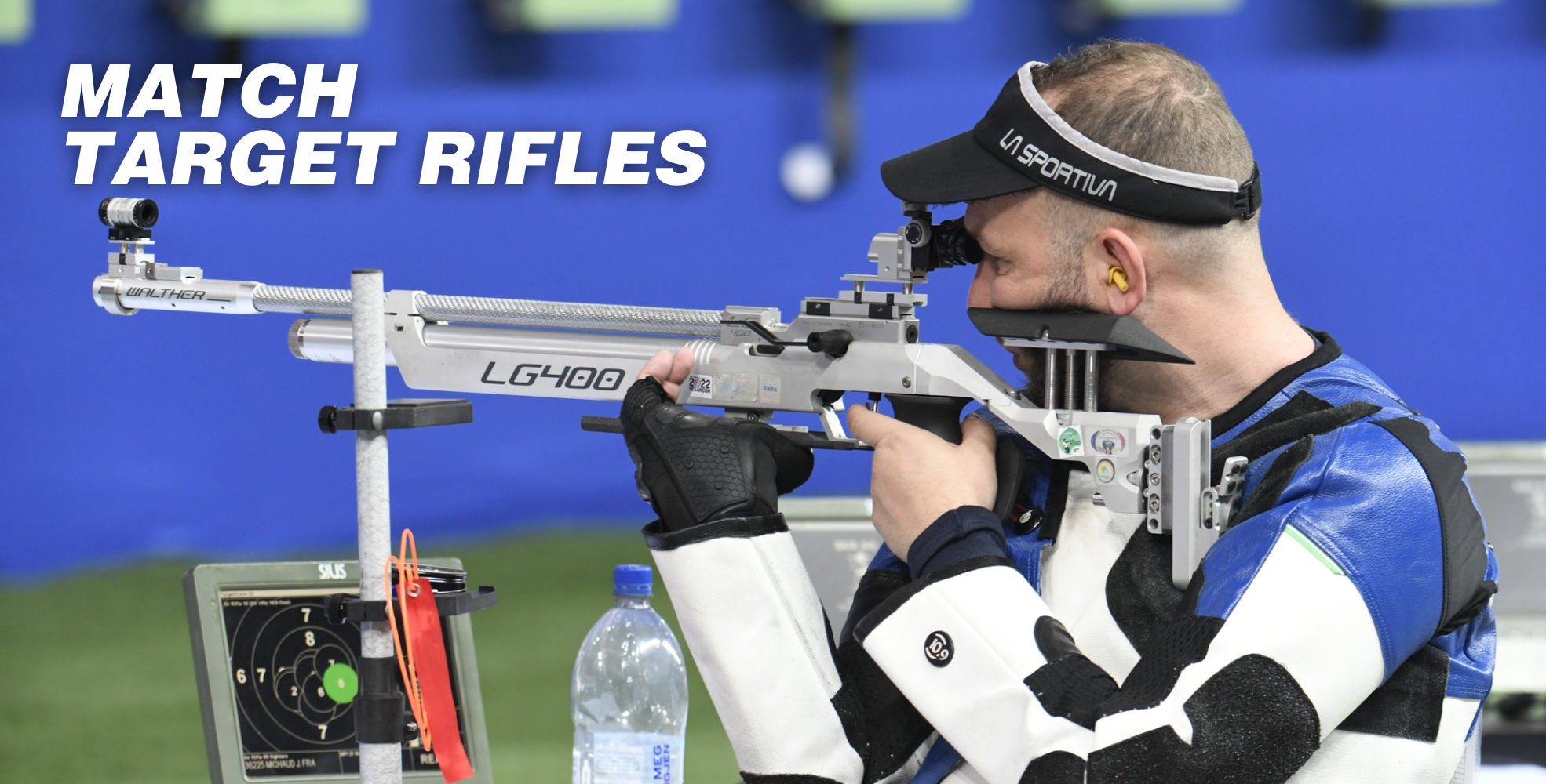 A person in a shooting position holds a target rifle, wearing protective gear and aiming at a target. The text "Match Target Rifles" is visible at the top.