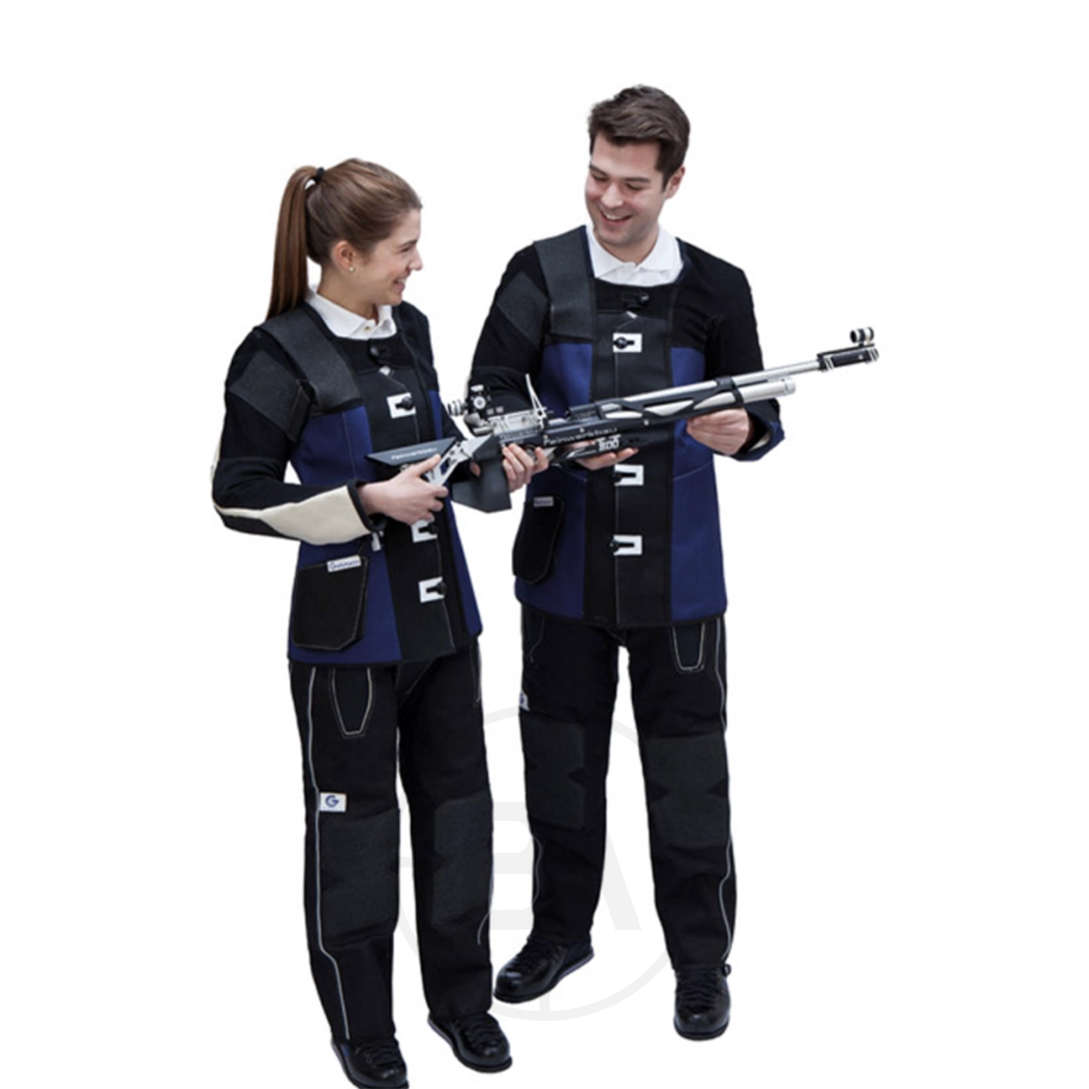 Gehmann Double Canvas Club Trousers 3 Two people wearing matching Gehmann Standard Double Canvas Jackets and pants stand together; one holds a rifle while they both look at it and smile.