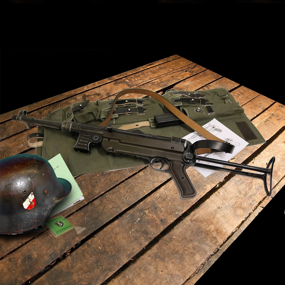 Umarex Legends MP German C02 BB Air Rifle 9 An Umarex Legends MP German CO2 BB Air Rifle, a steel helmet, documents, and military gear are displayed on a wooden table.