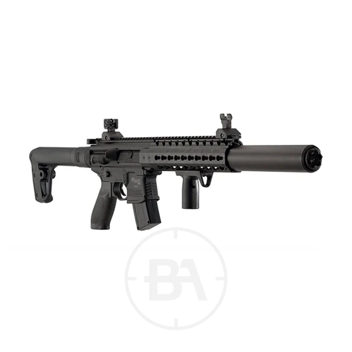 Sig Sauer MCX C02 Air Rifle 3 The Sig Sauer MCX CO2 Air Rifle, featuring a suppressor, adjustable stock, vertical foregrip, and rail-mounted iron sights, is displayed on a white background.